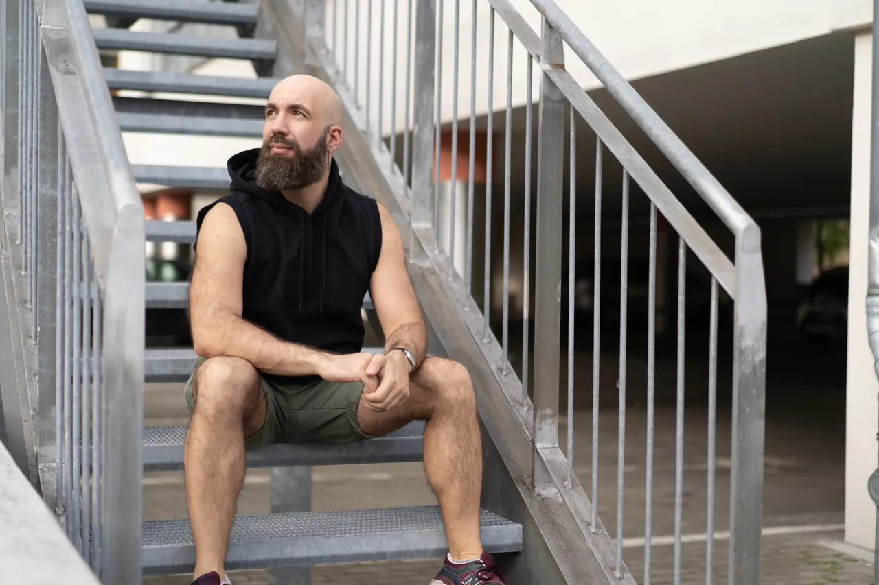Alexx Eon looking up from a staircase